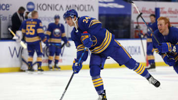 Jan 14, 2021; Buffalo, New York, USA; Buffalo Sabres center Dylan Cozens (24) takes a shot during warmups before a game against the Washington Capitals at KeyBank Center. Mandatory Credit: Timothy T. Ludwig-USA TODAY Sports