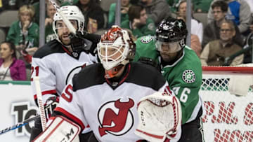 Nov 15, 2016; Dallas, TX, USA; New Jersey Devils right wing Kyle Palmieri (21) and goalie Cory Schneider (35) defends against Dallas Stars center Gemel Smith (46) during the second period at the American Airlines Center. Mandatory Credit: Jerome Miron-USA TODAY Sports