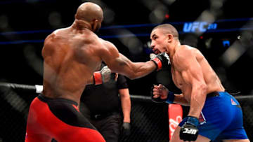 LAS VEGAS, NV - JULY 08: (L-R) Yoel Romero of Cuba punches Robert Whittaker of New Zealand in their interim UFC middleweight championship bout during the UFC 213 event at the T-Mobile Arena on July 8, 2017 in Las Vegas, Nevada. (Photo by Jeff Bottari/Zuffa LLC/Zuffa LLC via Getty Images)