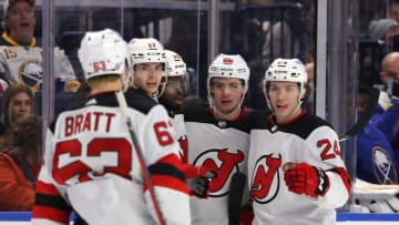Dec 29, 2021; Buffalo, New York, USA; New Jersey Devils center Jack Hughes (86) celebrates his goal with teammates during the third period against the Buffalo Sabres at KeyBank Center. Mandatory Credit: Timothy T. Ludwig-USA TODAY Sports