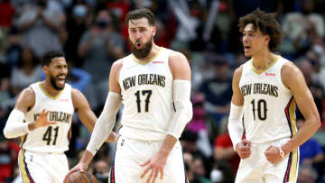 Jonas Valanciunas #17 of the New Orleans Pelicans reacts with teammates Jaxson Hayes #10 and Garrett Temple #41 (Photo by Sean Gardner/Getty Images)