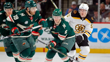 ST. PAUL, MN - APRIL 04: Ryan Donato #6 of the Minnesota Wild skates with the puck through traffic during a game with the Boston Bruins at Xcel Energy Center on April 4, 2019 in St. Paul, Minnesota.(Photo by Bruce Kluckhohn/NHLI via Getty Images)