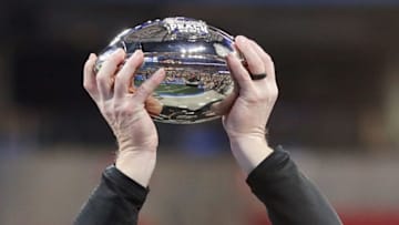 ATLANTA, GA - JANUARY 01: Head coach Scott Frost of the UCF Knights holds the trophy after defeating the Auburn Tigers 34-27 to win the Chick-fil-A Peach Bowl at Mercedes-Benz Stadium on January 1, 2018 in Atlanta, Georgia. (Photo by Streeter Lecka/Getty Images)