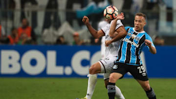 PORTO ALEGRE, BRAZIL - NOVEMBER 22: Arthur (R) of Gremio struggles for the ball with Jose Sand of Lanus during a first leg match between Gremio and Lanus as part of Copa Bridgestone Libertadores 2017 Final at Arena do Gremio on November 22, 2017 in Porto Alegre, Brazil. (Photo by Buda Mendes/Getty Images)
