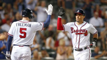Jun 28, 2016; Atlanta, GA, USA; Atlanta Braves first baseman Freddie Freeman (5) congratulates second baseman Jace Peterson (8) on a home run against the Cleveland Indians in the ninth inning at Turner Field. The Indians defeated the Braves 5-3. Mandatory Credit: Brett Davis-USA TODAY Sports