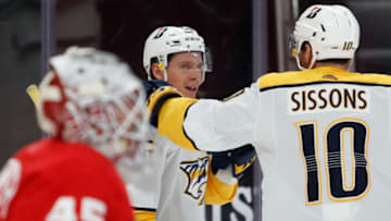 Feb 25, 2021; Detroit, Michigan, USA; Nashville Predators left wing Erik Haula (56) looks back and smiles after scoring a goal against Detroit Red Wings goaltender Jonathan Bernier (45) during the third period at Little Caesars Arena. Mandatory Credit: Raj Mehta-USA TODAY Sports