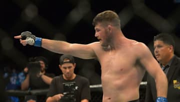 INGLEWOOD, CA - JUNE 04: Michael Bisping points to opponent Luke Rockhold after defeating him in their Middleweight Title Bout at UFC 199 at The Forum on June 4, 2016 in Inglewood, California. (Photo by Jayne Kamin-Oncea/Getty Images)