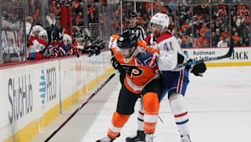 PHILADELPHIA, PA - FEBRUARY 20: Andrew MacDonald #47 of the Philadelphia Flyers keeps possession of the puck along the boards while battling with Paul Byron #41 of the Montreal Canadiens on February 20, 2018 at the Wells Fargo Center in Philadelphia, Pennsylvania. (Photo by Len Redkoles/NHLI via Getty Images)