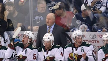 Sep 29, 2016; Winnipeg, Manitoba, CAN; Minnesota Wild head coach Bruce Boudreau (C) reacts from behind the bench during the second period during a preseason hockey game against the Winnipeg Jets at MTS Centre. Mandatory Credit: Bruce Fedyck-USA TODAY Sports
