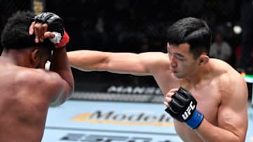 LAS VEGAS, NEVADA - NOVEMBER 13: (R-L) Da-un Jung of South Korea punches Kennedy Nzechukwu of Nigeria in a lightweight fight during the UFC Fight Night event at UFC APEX on November 13, 2021 in Las Vegas, Nevada. (Photo by Chris Unger/Zuffa LLC)