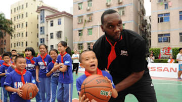 SHENZHEN, CN - OCTOBER 10: Al Jefferson of the Charlotte Hornets interacts with the kids during the Shenzhen Learn and Cares dedication as part of the 2015 Global Games China at the Jianlian School on October 10, 2015 in Shenzhen, China. NOTE TO USER: User expressly acknowledges and agrees that, by downloading and or using this photograph, User is consenting to the terms and conditions of the Getty Images License Agreement. Mandatory Copyright Notice: Copyright 2015 NBAE (Photo by Randy Belice/NBAE via Getty Images)