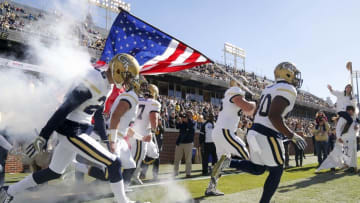 Nov 19, 2016; Atlanta, GA, USA; Georgia Tech Yellow Jackets players run onto the field before a game against the Virginia Cavaliers at Bobby Dodd Stadium. Mandatory Credit: Brett Davis-USA TODAY Sports