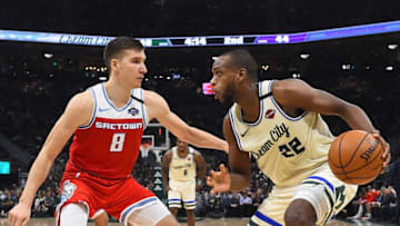 MILWAUKEE, WISCONSIN - FEBRUARY 10: Khris Middleton #22 of the Milwaukee Bucks is defended by Bogdan Bogdanovic #8 of the Sacramento Kings during the first half of a game at Fiserv Forum on February 10, 2020 in Milwaukee, Wisconsin. NOTE TO USER: User expressly acknowledges and agrees that, by downloading and or using this photograph, User is consenting to the terms and conditions of the Getty Images License Agreement. (Photo by Stacy Revere/Getty Images)