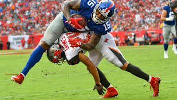 TAMPA, FL - OCTOBER 01: New York Giants wide receiver Brandon Marshall (15) is brought down by Tampa Bay Buccaneers cornerback Brent Grimes (24) after a reception during an NFL football game between the New York Giants and the Tampa Bay Buccaneers on October 01, 2017, at Raymond James Stadium in Tampa, FL. (Photo by Roy K. Miller/Icon Sportswire via Getty Images)