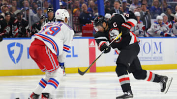 Mar 11, 2023; Buffalo, New York, USA; New York Rangers defenseman K'Andre Miller (79) looks to block a shot by Buffalo Sabres right wing Kyle Okposo (21) during the second period at KeyBank Center. Mandatory Credit: Timothy T. Ludwig-USA TODAY Sports