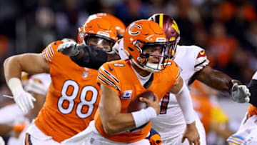 CHICAGO, ILLINOIS - OCTOBER 13: Justin Fields #1 of the Chicago Bears scrambles during the first quarter against the Washington Commanders at Soldier Field on October 13, 2022 in Chicago, Illinois. (Photo by Michael Reaves/Getty Images)