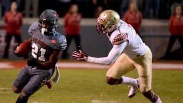 Nov 5, 2016; Raleigh, NC, USA; North Carolina State Wolfpack running back Matt Dayes (21) runs the ball during the first half against the Florida State Seminoles at Carter Finley Stadium. Mandatory Credit: Rob Kinnan-USA TODAY Sports