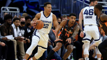 ORLANDO, FLORIDA - FEBRUARY 05: Desmond Bane #22 of the Memphis Grizzlies drives on Gary Harris #14 of the Orlando Magic during a game at Amway Center on February 05, 2022 in Orlando, Florida. NOTE TO USER: User expressly acknowledges and agrees that, by downloading and or using this photograph, User is consenting to the terms and conditions of the Getty Images License Agreement. (Photo by Mike Ehrmann/Getty Images)