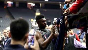 SACRAMENTO, CALIFORNIA - JANUARY 04: Injured Zion Williamson #1 of the New Orleans Pelicans signs autographs before their game against the Sacramento Kings at Golden 1 Center on January 04, 2020 in Sacramento, California. NOTE TO USER: User expressly acknowledges and agrees that, by downloading and/or using this photograph, user is consenting to the terms and conditions of the Getty Images License Agreement. (Photo by Ezra Shaw/Getty Images)