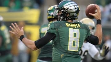 Oct 26, 2013; Eugene, OR, USA; Oregon Ducks quarterback Marcus Mariota (8) throws the ball against the UCLA Bruins at Autzen Stadium. Mandatory Credit: Scott Olmos-USA TODAY Sports