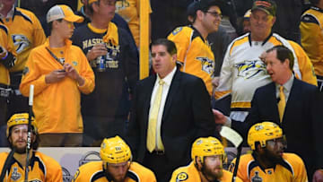 NASHVILLE, TN - JUNE 11: Head Coach Peter Laviolette of the Nashville Predators and assistant coach Phil Housley, far right, look on from the bench area in the second period of Game Six of the 2017 NHL Stanley Cup Final at the Bridgestone Arena on June 11, 2017 in Nashville, Tennessee. (Photo by Joe Sargent/NHLI via Getty Images)