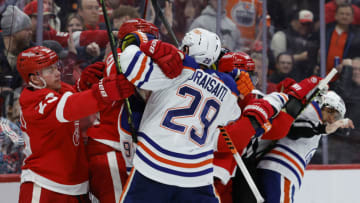 Detroit Red Wings left wing Lucas Raymond (23) and Edmonton Oilers center Leon Draisaitl (29) shove each other. Mandatory Credit: Rick Osentoski-USA TODAY Sports