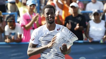 Jul 24, 2016; Washington, DC, USA; Gael Monfils of France celebrates with the championship trophy after his match against Ivo Karlovic of Croatia (not pictured) in the men