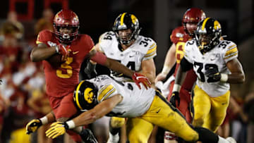 AMES, IA - SEPTEMBER 14: Running back Kene Nwangwu #3 of the Iowa State Cyclones is tackled bye defensive end A.J. Epenesa #94 of the Iowa Hawkeyes as he rushed for yards in the second half of play at Jack Trice Stadium on September 14, 2019 in Ames, Iowa. The Iowa Hawkeyes won 18-17 over the Iowa State Cyclones. (Photo by David Purdy/Getty Images)