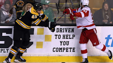 BOSTON - MARCH 6: Detroit Red Wings' Frans Nielsen, right, is injured by a hit from the Bruins' David Backes during the first period. The Boston Bruins host the Detroit Red Wings in a regular season NHL hockey game at TD Garden in Boston on March 6, 2018. (Photo by Jim Davis/The Boston Globe via Getty Images)