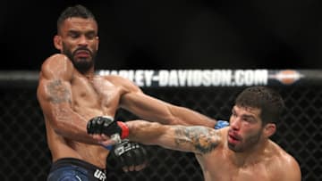 LAS VEGAS, NV - JULY 07: Raphael Assuncao of Brazil punches Rob Font in their bantamweight fight during the UFC 226 event inside T-Mobile Arena on July 7, 2018 in Las Vegas, Nevada. (Photo by Christian Petersen/Zuffa LLC/Zuffa LLC via Getty Images)