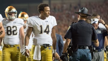 Sep 4, 2016; Austin, TX, USA; Notre Dame Fighting Irish quarterback DeShone Kizer (14) leaves the field after Texas defeated Notre Dame 50-47 in double overtime at Darrell K. Royal-Texas Memorial Stadium. Mandatory Credit: Matt Cashore-USA TODAY Sports