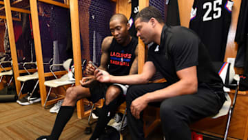 SALT LAKE CITY, UT - APRIL 23: Jamal Crawford #11 of the LA Clippers talks with trainer Jasen Powell before the game against the Utah Jazz in Game Four during the Western Conference Quarterfinals of the 2017 NBA Playoffs on April 23, 2017 at Vivint Smart Home Arena in Salt Lake City, Utah. NOTE TO USER: User expressly acknowledges and agrees that, by downloading and or using this Photograph, User is consenting to the terms and conditions of the Getty Images License Agreement. Mandatory Copyright Notice: Copyright 2017 NBAE (Photo by Andrew D. Bernstein/NBAE via Getty Images)