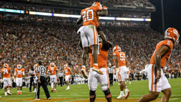 Clemson running back Kobe Pace (20) is congratulated by offensive lineman Jordan McFadden (71) after scoring during the second quarter at Memorial Stadium in Clemson, S.C., October 2, 2021.Ncaa Football Acc Clemson Boston College