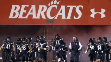 CINCINNATI, OH - NOVEMBER 13: Head coach Luke Fickell of the Cincinnati Bearcats runs onto the field with his team before a game against the East Carolina Pirates at Nippert Stadium on November 13, 2020 in Cincinnati, Ohio. Cincinnati defeated East Carolina 55-17. (Photo by Joe Robbins/Getty Images)
