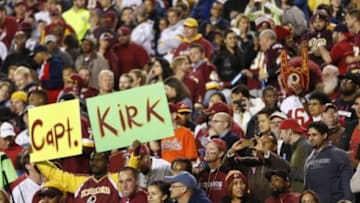 Oct 6, 2014; Landover, MD, USA; A Washington Redskins fan holds a sign from the stands against the Seattle Seahawks at FedEx Field. Mandatory Credit: Geoff Burke-USA TODAY Sports