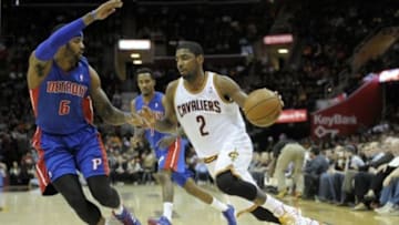 Dec 23, 2013; Cleveland, OH, USA; Cleveland Cavaliers point guard Kyrie Irving (2) drives against Detroit Pistons small forward Josh Smith (6) and point guard Brandon Jennings (7) in the second quarter at Quicken Loans Arena. Mandatory Credit: David Richard-USA TODAY Sports