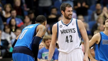 Nov 8, 2013; Minneapolis, MN, USA; Minnesota Timberwolves forward Kevin Love (42) smiles talking to Dallas Mavericks forward Shawn Marion (0) during the fourth quarter at Target Center. The Timberwolves defeated the Mavericks 116-108. Mandatory Credit: Brace Hemmelgarn-USA TODAY Sports