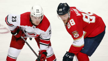 SUNRISE, FL - APRIL 2: Brock McGinn #23 of the Carolina Hurricanes gets set for a face off against his brother Jamie McGinn #88 of the Florida Panthers at the BB&T Center on April 2, 2018 in Sunrise, Florida. (Photo by Eliot J. Schechter/NHLI via Getty Images)