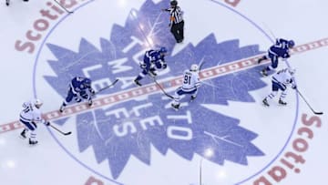 Anthony Cirelli #71 of the Tampa Bay Lightning takes a faceoff against John Tavares #91 of the Toronto Maple Leafs during an NHL game at Scotiabank Arena on March 11, 2019 in Toronto, Ontario, Canada. (Photo by Claus Andersen/Getty Images)