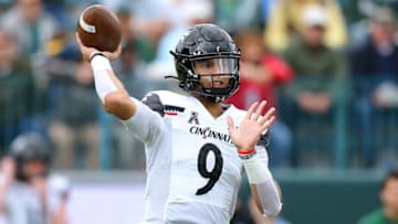 NEW ORLEANS, LOUISIANA - OCTOBER 30: Desmond Ridder #9 of the Cincinnati Bearcats throws the ball during the first half against the Tulane Green Wave at Yulman Stadium on October 30, 2021 in New Orleans, Louisiana. (Photo by Jonathan Bachman/Getty Images)
