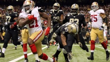 Nov 9, 2014; New Orleans, LA, USA; San Francisco 49ers running back Frank Gore (21) carries the ball to score a touchdown against the New Orleans Saints in the first quarter at Mercedes-Benz Superdome. Mandatory Credit: Chuck Cook-USA TODAY Sports
