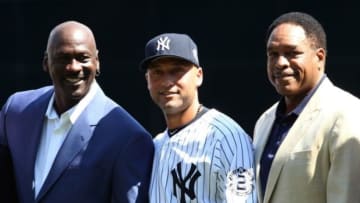 Sep 7, 2014; Bronx, NY, USA; New York Yankees shortstop Derek Jeter (middle) poses with NBA former player Michael Jordan (left) and Yankees former player Dave Winfield at a ceremony before the game against the Kansas City Royals at Yankee Stadium. Mandatory Credit: Noah K. Murray-USA TODAY Sports
