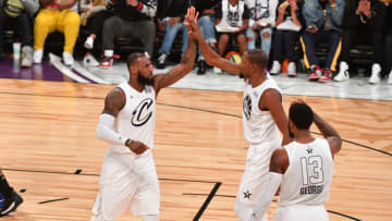 LOS ANGELES, CA - FEBRUARY 18: LeBron James #23, Kevin Durant #35 and Paul George #13 of Team LeBron give each other high fives against Team Curry during the NBA All-Star Game as a part of 2018 NBA All-Star Weekend at STAPLES Center on February 18, 2018 in Los Angeles, California. NOTE TO USER: User expressly acknowledges and agrees that, by downloading and/or using this photograph, user is consenting to the terms and conditions of the Getty Images License Agreement. Mandatory Copyright Notice: Copyright 2018 NBAE (Photo by Jesse D. Garrabrant/NBAE via Getty Images)