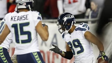 Nov 13, 2016; Foxborough, MA, USA; Seattle Seahawks wide receiver Doug Baldwin (89) celebrates with wide receiver Jermaine Kearse (15) after scoring a touchdown during the fourth quarter against the New England Patriots at Gillette Stadium. The Seattle Seahawks won 31-24. Mandatory Credit: Greg M. Cooper-USA TODAY Sports