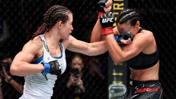 LAS VEGAS, NEVADA - JULY 17: (L-R) Miesha Tate punches Marion Reneau in their bantamweight bout during the UFC Fight Night event at UFC APEX on July 17, 2021 in Las Vegas, Nevada. (Photo by Jeff Bottari/Zuffa LLC)