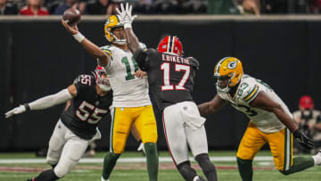 Sep 17, 2023; Atlanta, Georgia, USA; Green Bay Packers quarterback Jordan Love (10) passes under pressure from Atlanta Falcons linebacker Kaden Elliss (55) and linebacker Arnold Ebiketie (17) during the second half at Mercedes-Benz Stadium. Mandatory Credit: Dale Zanine-USA TODAY Sports