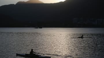 RIO DE JANEIRO, BRAZIL - AUGUST 12: A rower paddles on the polluted Rodrigo de Freitas lagoon on August 12, 2015 in Rio de Janeiro, Brazil. Last week 15 U.S. team members became ill after competing in the waters at the World Junior Rowing Championships. Some believe the illnesses were caused by the polluted waters at the lagoon although Rio officials said the waters were not to blame. The lagoon will be the venue site for rowing events at the Rio 2016 Olympic Games. (Photo by Mario Tama/Getty Images)