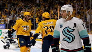 Luke Kunin #11 of the Nashville Predators celebrates a goal by Eeli Tolvanen #28 against the Seattle Kraken in the first period at Bridgestone Arena on October 14, 2021 in Nashville, Tennessee. (Photo by Brett Carlsen/Getty Images)