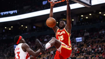 TORONTO, ON - APRIL 05: Clint Capela #15 of the Atlanta Hawks dunks on Pascal Siakam #43 of the Toronto Raptors (Photo by Cole Burston/Getty Images)