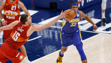 Nikola Jokic #15 of the Denver Nuggets reaches for the ball against Myles Turner #33 of the Indiana Pacers at Bankers Life Fieldhouse (Photo by Michael Hickey/Getty Images)